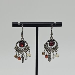 silver tone chandelier earrings with red center and beaded dangles